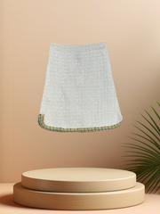 Marccain white thread knitted skirt on display, featuring a breathable design and above-knee length for spring and summer fashion.