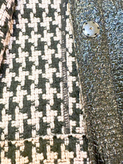 Close-up of Marccain Reversible Jacket showing elegant Houndstooth pattern and sleek black leather look.