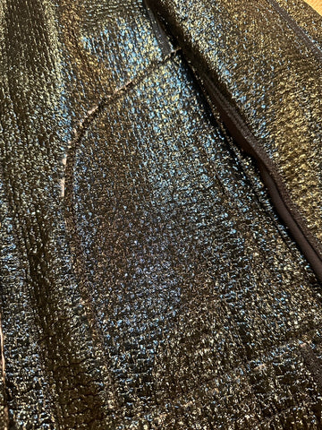 Close-up of the shimmering black leather texture of Marccain Reversible Jacket, showcasing its elegant design.