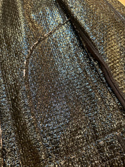 Close-up of the shimmering black leather texture of Marccain Reversible Jacket, showcasing its elegant design.