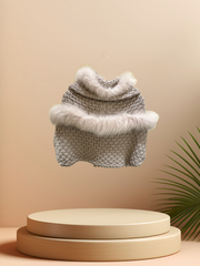 Stylish Tricot Chic Shawl featuring a soft fur trim, perfect for adding warmth and elegance to any outfit.