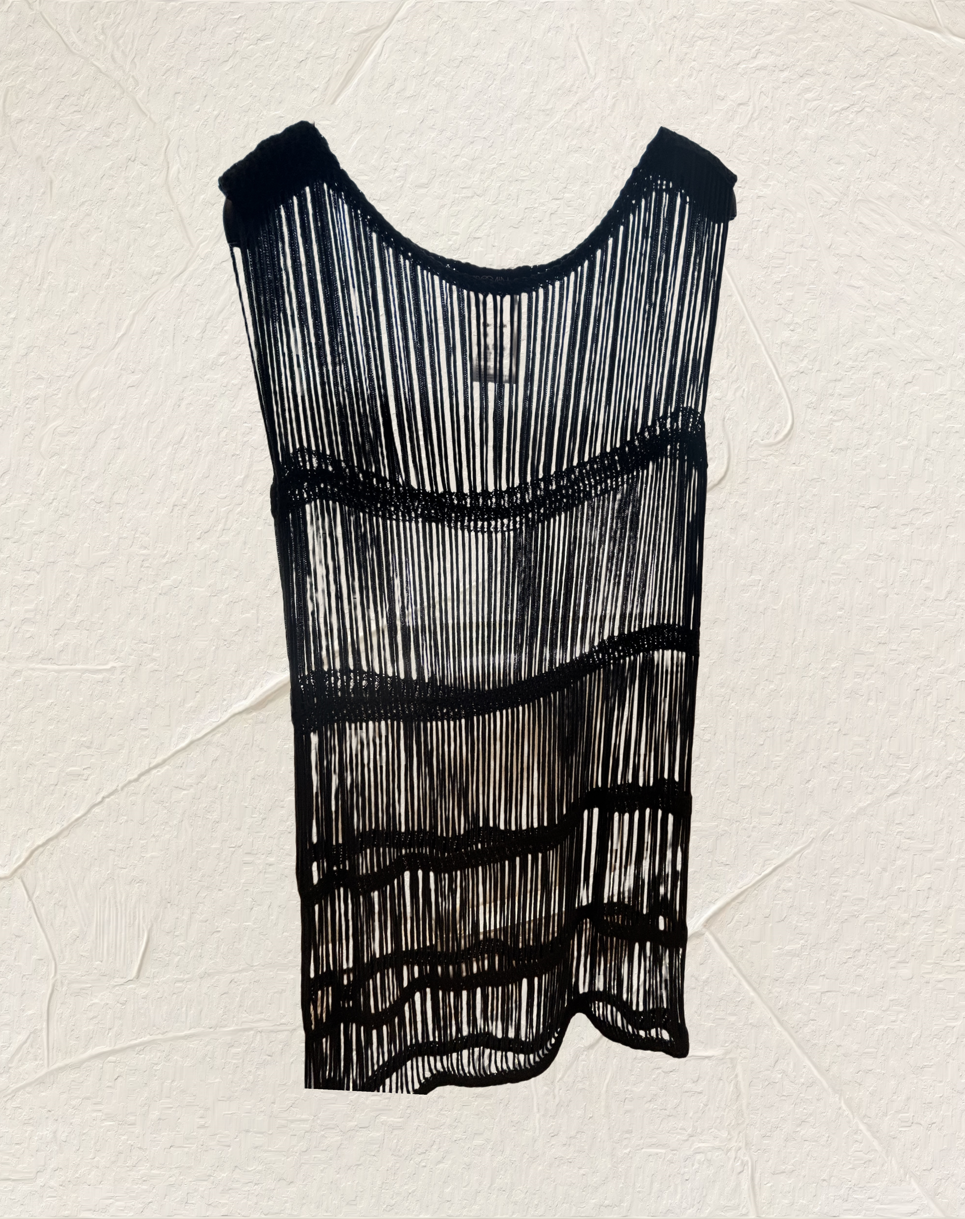 Black fringed dress showcasing a unique design with vertical lines and layered texture, perfect for stylish outfits.