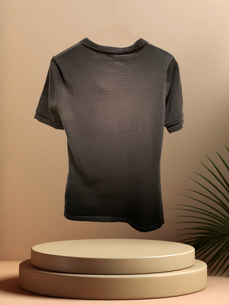 Back view of a stylish short-sleeve black blouse displayed on a minimalistic stand, ideal for casual or formal wear.