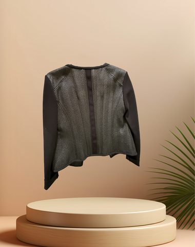 Marccain black jacket with unique zig zag pattern on display, featuring zip closure for a rock-inspired look.
