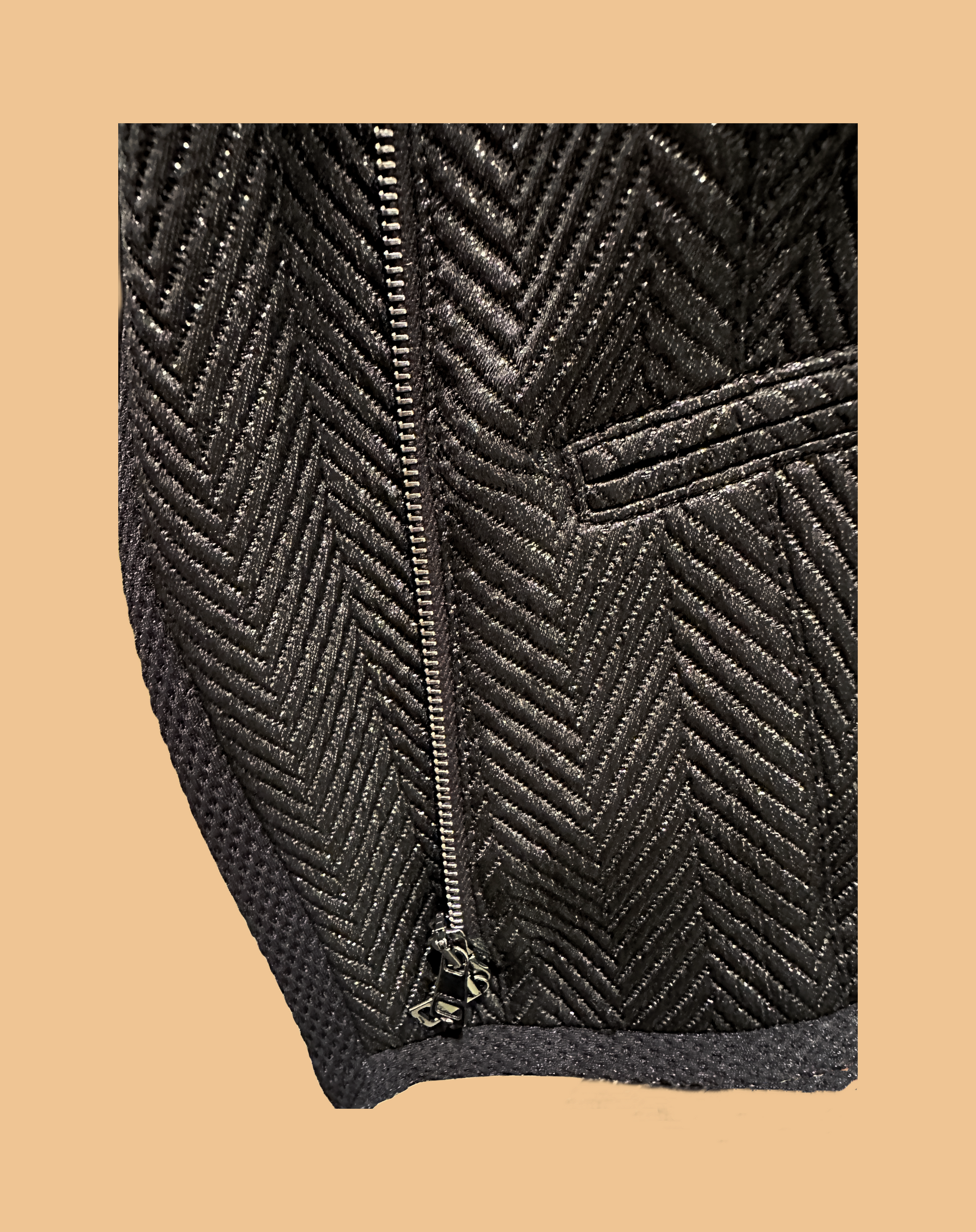 Marccain black jacket featuring a unique zig zag pattern and zip closure, perfect for a rock-inspired style.