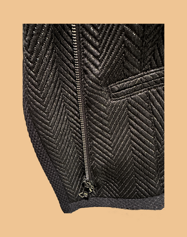 Marccain black jacket featuring a unique zig zag pattern and zip closure, perfect for a rock-inspired style.