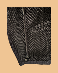 Marccain black jacket featuring a unique zig zag pattern and zip closure, perfect for a rock-inspired style.