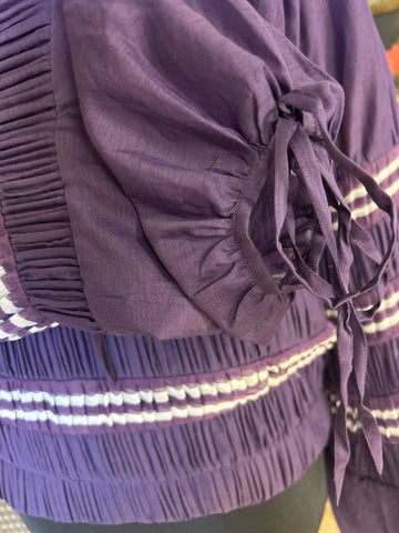 Jean Paul Gaultier purple blouse with puff sleeves and intricate detailing, made of 70% cotton and 30% silk.