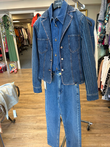 Karl Lagerfeld denim vest displayed on rack, showcasing stylish design and high-quality denim material.