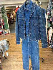 Karl Lagerfeld denim vest displayed on rack, showcasing stylish design and high-quality denim material.