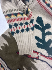 Close-up of the sleeve design on the Laurel Christmas Sweater featuring festive patterns and colors.