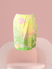 Laurel Silk Skirt in vibrant yellow and green with floral print, featuring a front wrap design, showcasing elegance.