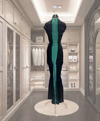 Madame Moje Green Dress showcased in a stylish closet, featuring form-fitting design and zip zap stripes.