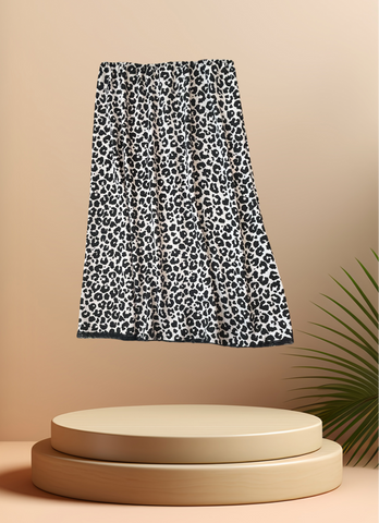 Marccain 2 Layers Leopard Print Skirt displayed against a minimal backdrop, featuring elegant two-layer design.