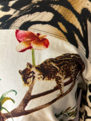 Close-up of Marccain blouse with animal print featuring a cat and orchid design, showcasing sophisticated style.