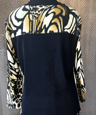Marccain blouse with unique animal print design, featuring a stylish black back and elegantly patterned sleeves.