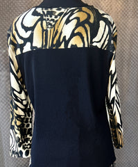 Marccain blouse with unique animal print design, featuring a stylish black back and elegantly patterned sleeves.