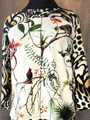 Marccain blouse featuring a unique animal figure print with botanical accents and stylish design elements.