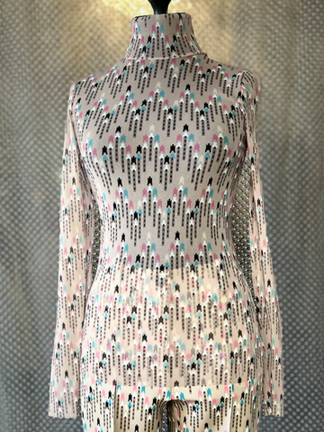 Marccain Blouse featuring signature patterns and transparent fabric, perfect for versatile styling options.