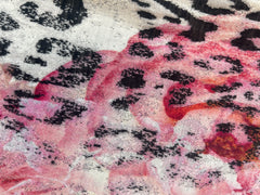 Close-up of Marccain floral leopard print fabric showcasing vibrant colors and unique patterns.