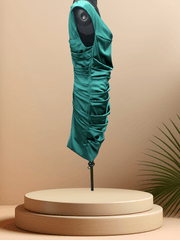 Elegant Marccain green satin dress showcasing a unique wrinkled design on a display stand.