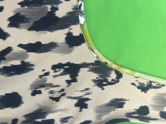 Close-up of Marccain leopard print tank with vibrant green trim, showcasing trendy Fall 2024 fashion.