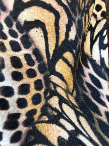 Close-up of Marccain Leopard Skirt fabric showcasing vivid leopard print pattern and texture.