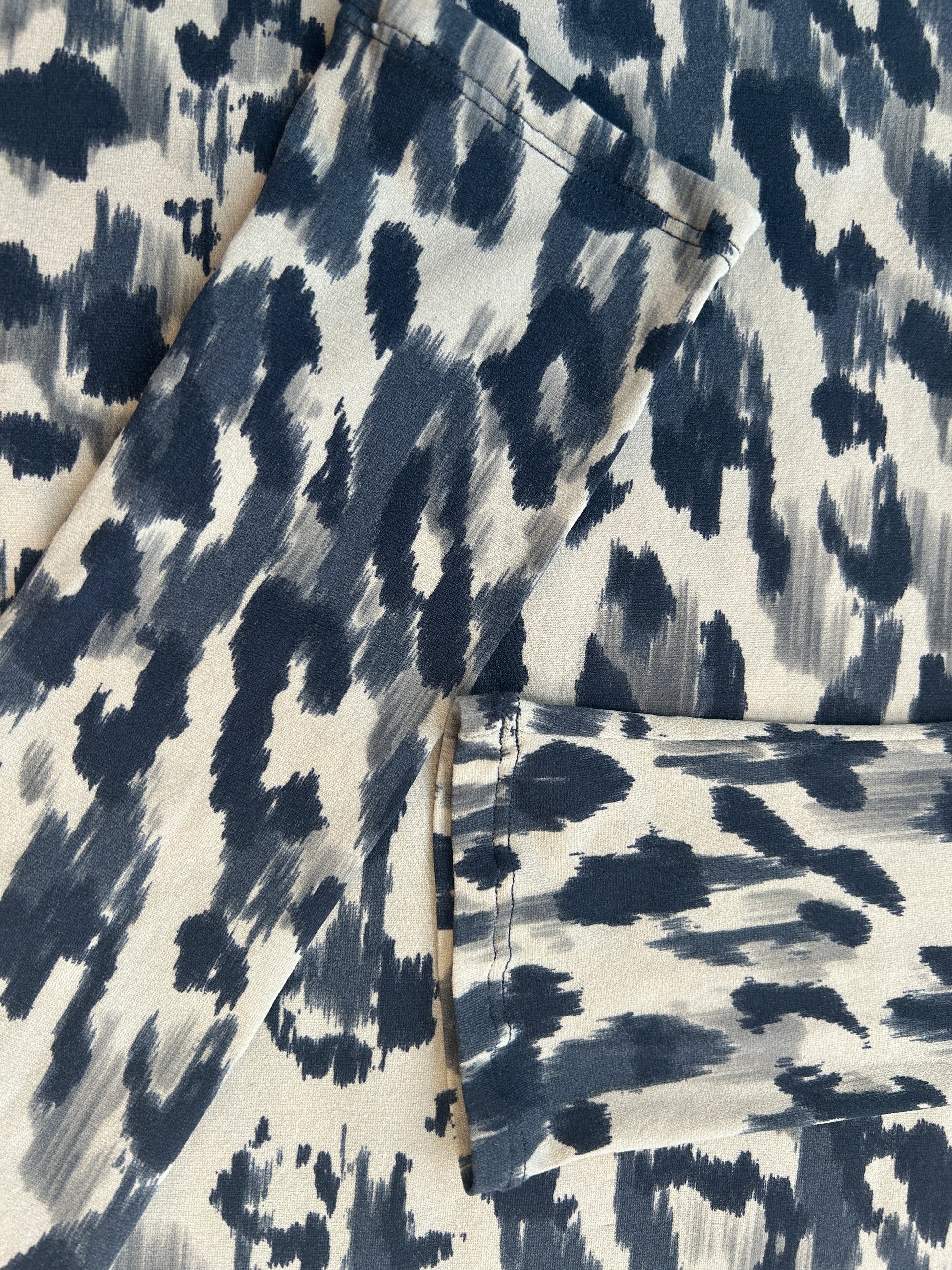 Close-up of Marccain Silk Leopard Print Shirt in elegant blue and white pattern, showcasing its luxurious silk texture.