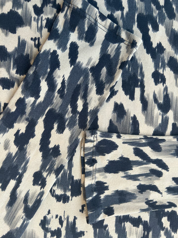 Close-up of Marccain Silk Leopard Print Shirt in elegant blue and white pattern, showcasing its luxurious silk texture.