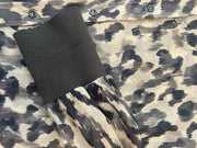 Detail view of Marccain silk leopard print shirt showcasing fabric texture and stylish sleeve.