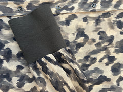 Detail view of Marccain silk leopard print shirt showcasing fabric texture and stylish sleeve.