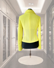 Marccain Yellow Jacket in bright yellow knit, showcasing unique design and stylish craftsmanship in a modern wardrobe setting.