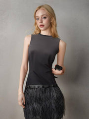 Model wearing Michael Kors Black Feather Dress featuring a figure-flattering design and trendy feather skirt.