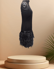 Michael Kors Black Feather Dress with a stylish feather skirt displayed on a pedestal against a soft background.