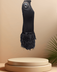 Michael Kors Black Feather Dress with a stylish feather skirt displayed on a pedestal against a soft background.