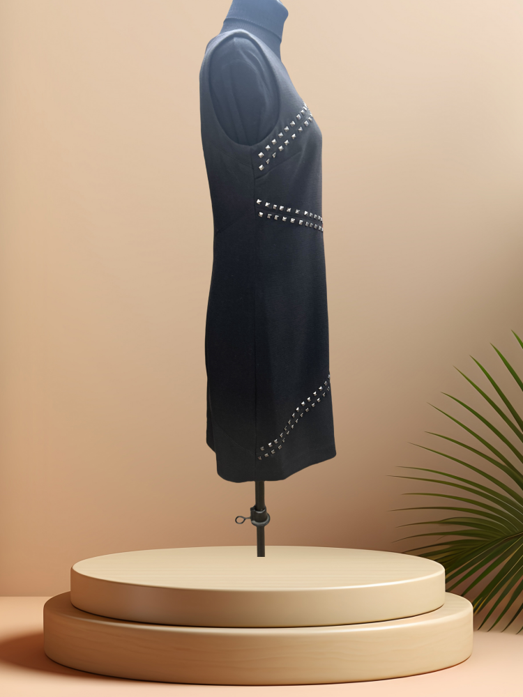 Michael Kors Rivet Dress showcasing front rivet decoration on a sleek black straight cut silhouette.