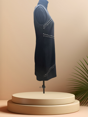 Michael Kors Rivet Dress showcasing front rivet decoration on a sleek black straight cut silhouette.