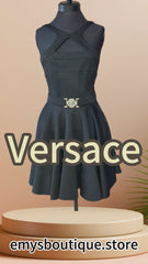 Versace black dress featuring a low cut back, strip sleeves, and circular skirt for a chic and feminine look.