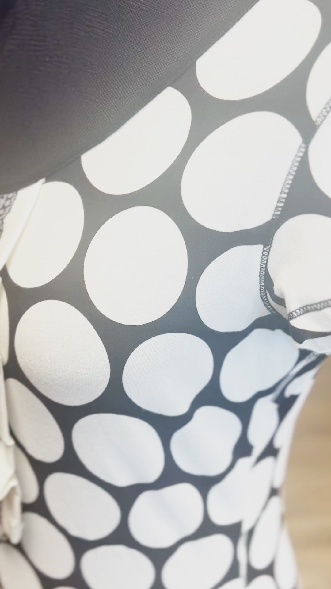 Close-up of the Ambiente B&W Polka Dot Blouse showcasing its unique polka dot pattern on a comfortable cotton fabric.