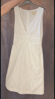 Michael Kors white summer dress with eyelet design, perfect for stylish comfort in warm weather.