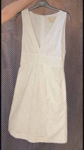 Michael Kors white summer dress with eyelet design, perfect for stylish comfort in warm weather.