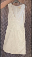 Michael Kors white summer dress with eyelet design, perfect for stylish comfort in warm weather.