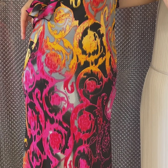 Versace Water Print Dress featuring vibrant colors and elegant design, perfect for showcasing confidence and beauty.