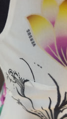 Close-up of Versace Silk Lotus Flower Dress showcasing vibrant flower print and intricate detailing.
