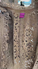 Close-up of Save the Queen Hollow Carving Leather Coat showcasing intricate hollow design and brand tag.