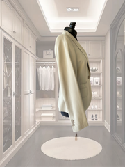 Seventy beige jacket displayed in an elegant wardrobe setting, showcasing its classic and sophisticated design.