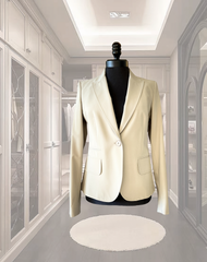 Seventy Beige Jacket displayed on a mannequin, showcasing its classic cut in a stylish wardrobe setting.