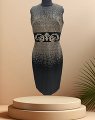Versace black dress with golden logo and bead embellishments, elegantly designed for a sophisticated look.