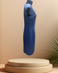 Versace navy blue dress displayed on a pedestal, featuring a straight cut and elegant design, perfect for various occasions.