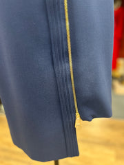 Close-up of Versace navy blue dress featuring a stylish golden zipper detail and sleek design.